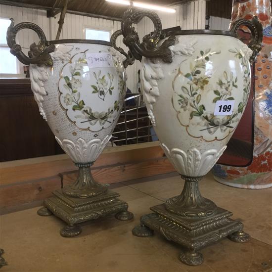 Pair of ceramic vases on brass bases